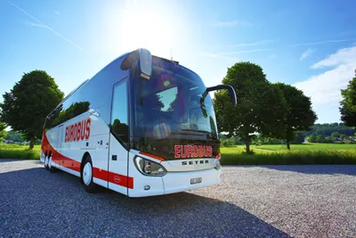 A EUROBUS Comfort coach in the sunshine, seen from the front