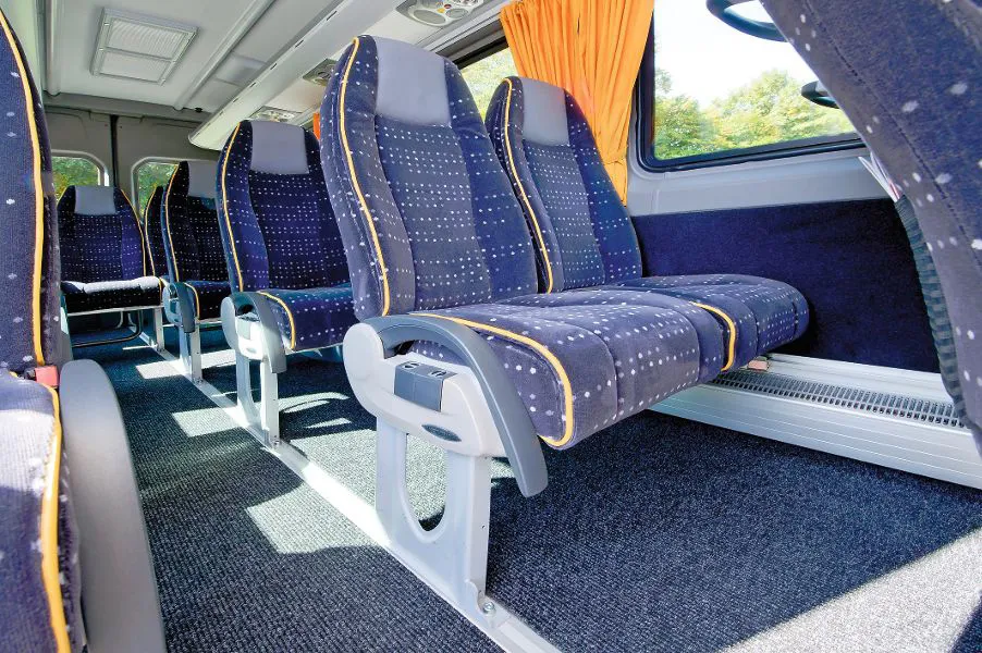 Blue comfort seats in the minibus