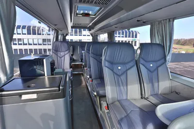 Leather seats and a table inside the VIPLINER minibus