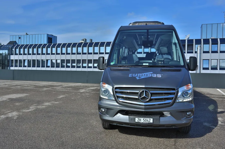 The VIPLINER minibus in front of a modern building