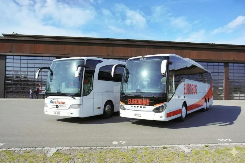 A EUROBUS Settelen coach parked in front of a building in Basel